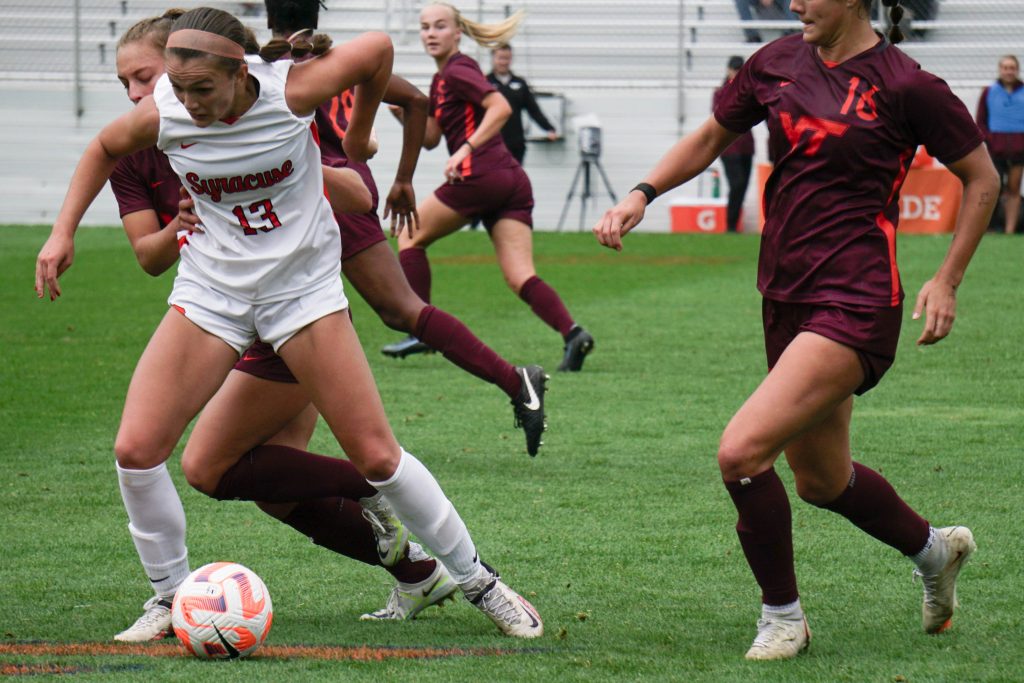 Sophomore forward Anna Rupert maintains possession of the ball against Virginia Tech defense on Sunday.