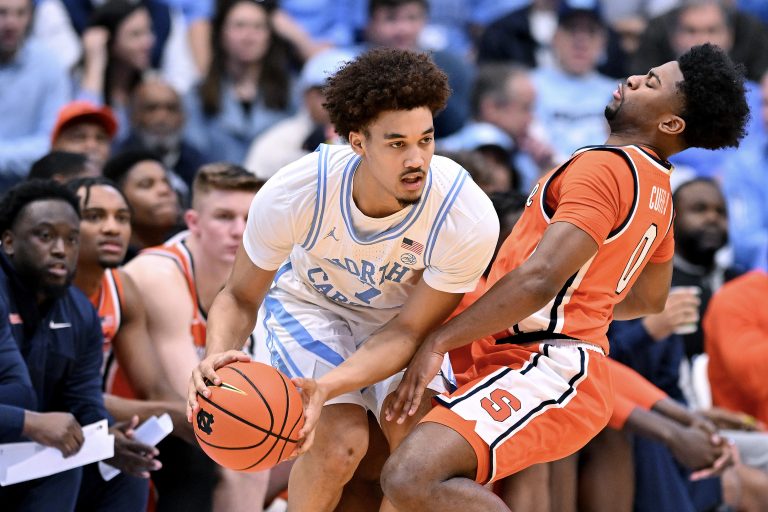Kyle Cuffe Jr. #0 of the Syracuse Orange defends Seth Trimble #7 of the North Carolina Tar Heels during the first half of the game at the Dean E. Smith Center on January 13, 2024 in Chapel Hill, North Carolina.