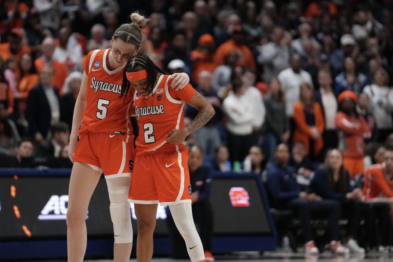 Georgia Woolley #5 and Dyaisha Fair #2 of the Syracuse Orange react during the second half of a second round NCAA Women's Basketball Tournament game against the Connecticut Huskies at the Harry A. Gampel Pavilion on March 25, 2024 in Storrs, Connecticut.
