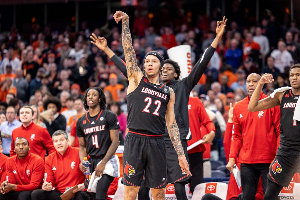 Louisville guard Tre White (#22) sinks a corner 3 against the Orange at Wednesday's game.