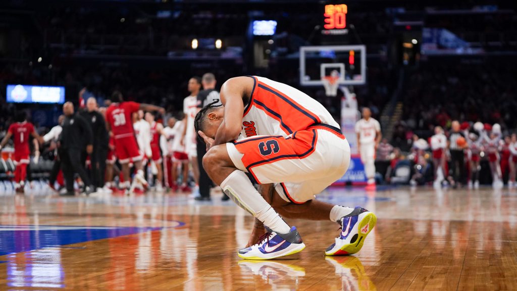Judah Mintz covers his face after a turnover during the Syracuse-North Carolina State second-round game of the ACC men's basketball tournament on March 13, 2024, at the Capital One Arena in Washington, D.C.