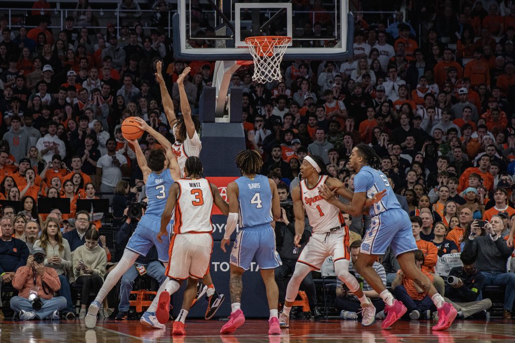 #4 Cormac Ryan of the North Carolina Tar Heels attempts a shot against Syracuse University in the JMA Wireless Dome on February 13, 2024. (Photo by Arthur Maiorella)