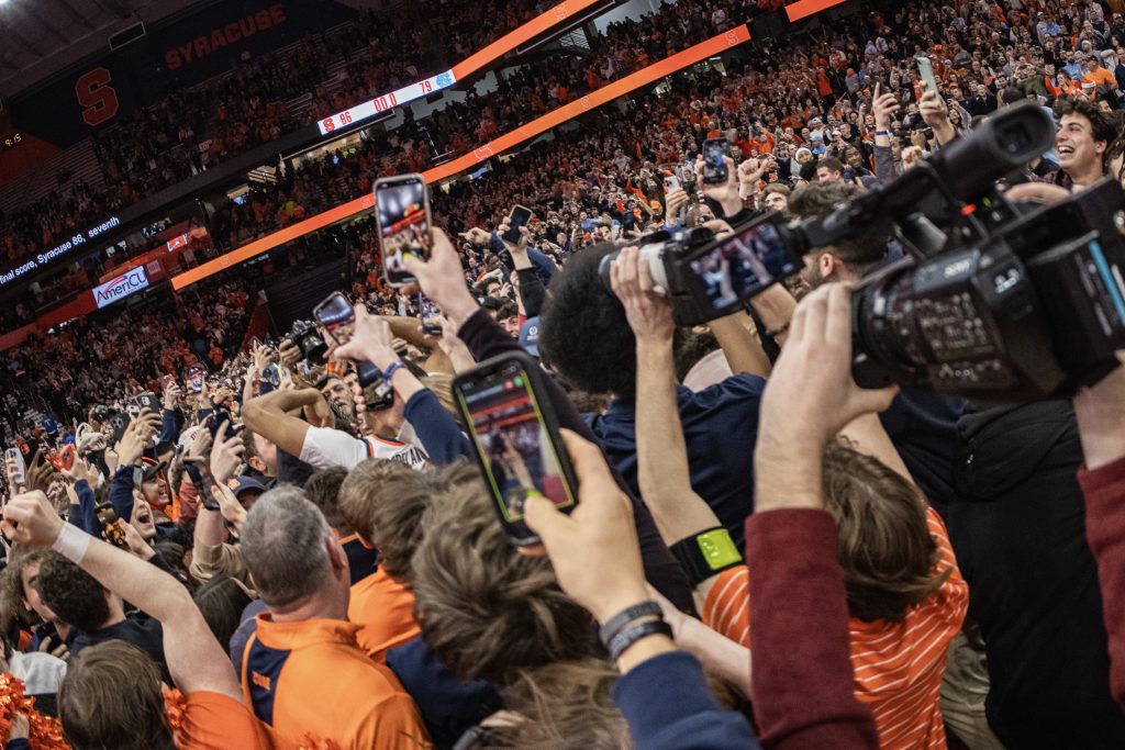 Fans mob the Syracuse basketball players after their win over North Carolina in the JMA Wireless Dome on February 13., 2024