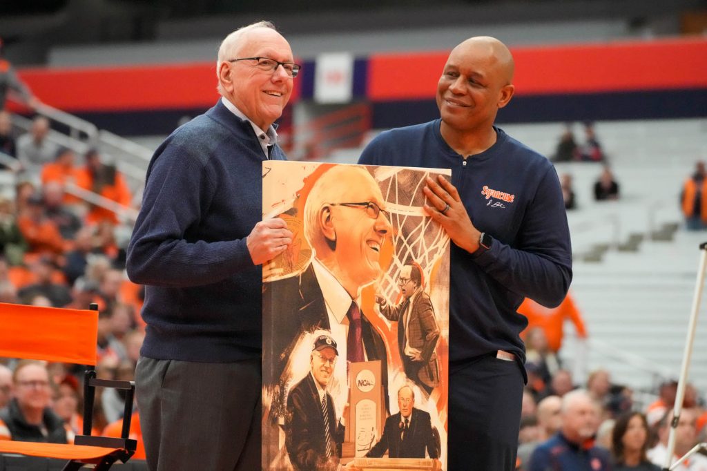 Coach Adrian Autry presents his predecessor Jim Boeheim with an art piece, honoring his career at Jim Boeheim Day on Saturday, February 24.