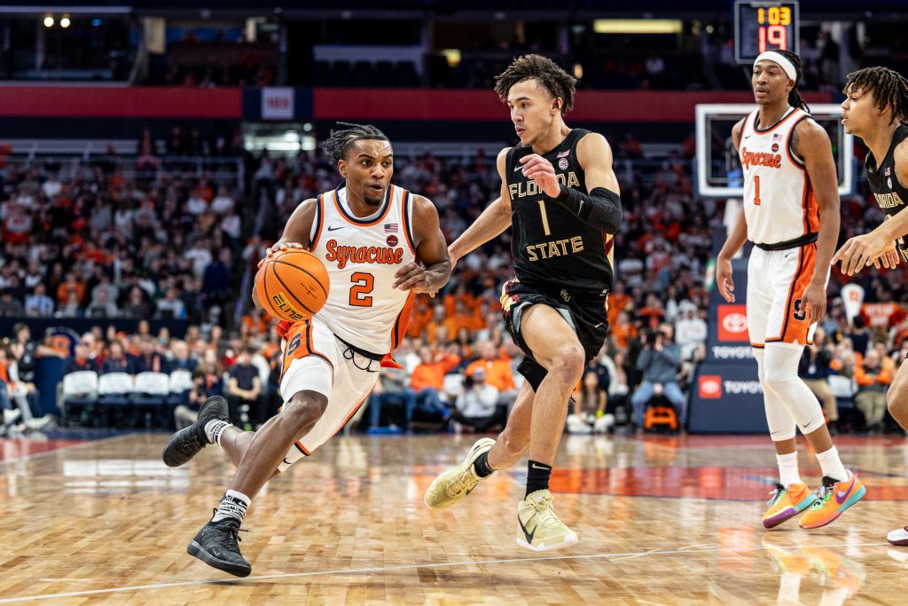 Syracuse Guard J.J Sterling (#2) drives to the hoop against FSU Guard Jalen Warley (#1) during the Syracuse-Florida State game on Jan. 23, 2024 in the JMA Wireless Dome.