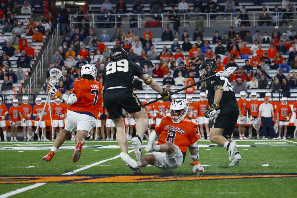 SU's Michael Leo (#7) breaks through Army defense after a struggle at Wednesday night's game.