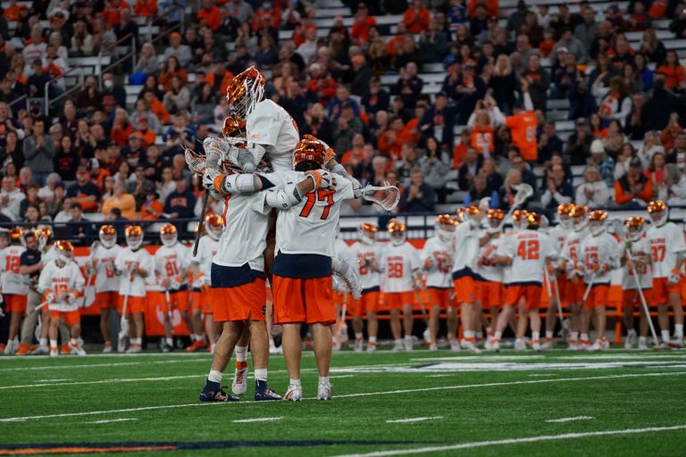 Syracuse’s attack celebrates a goal against Vermont on Saturday.