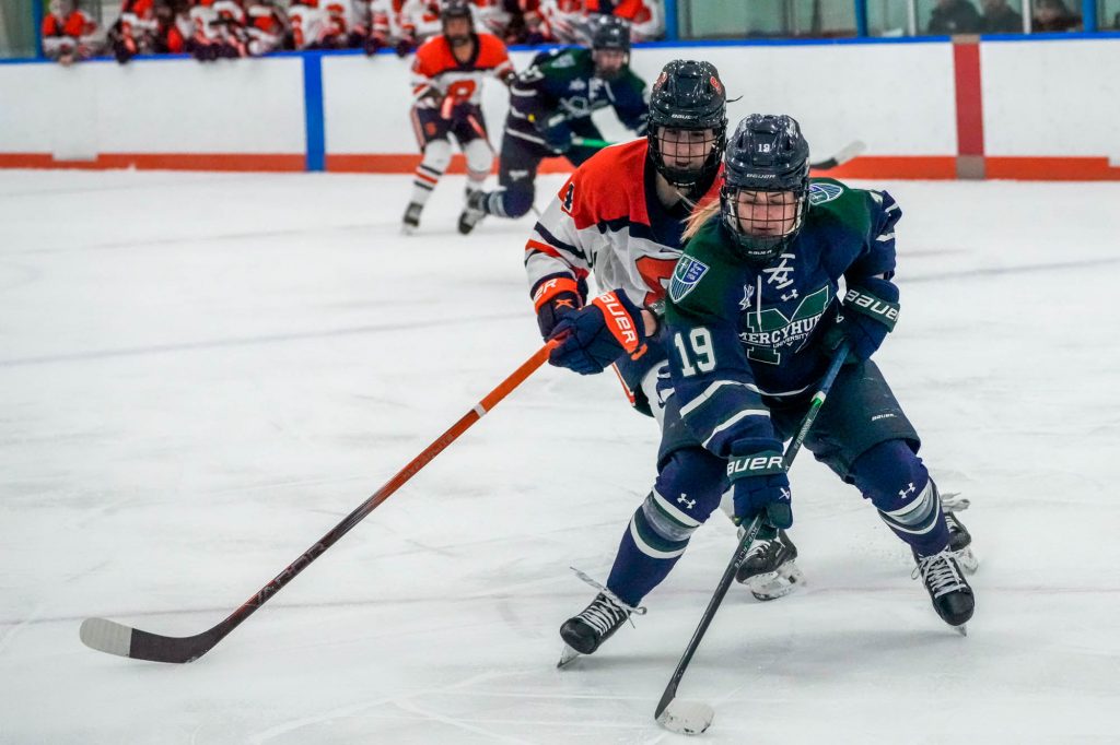 Mercyhurst (#19) gets in front of Defender Alexandria Weiss on the way to the goal, Saturday at Tennity Ice Rink.