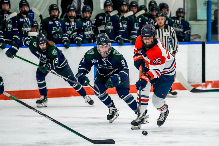 Defender Charlotte Hallett (#22) is pursued by the Mercyhurst offense at Saturday's game at Tennity Ice Rink, February 17, 2024.