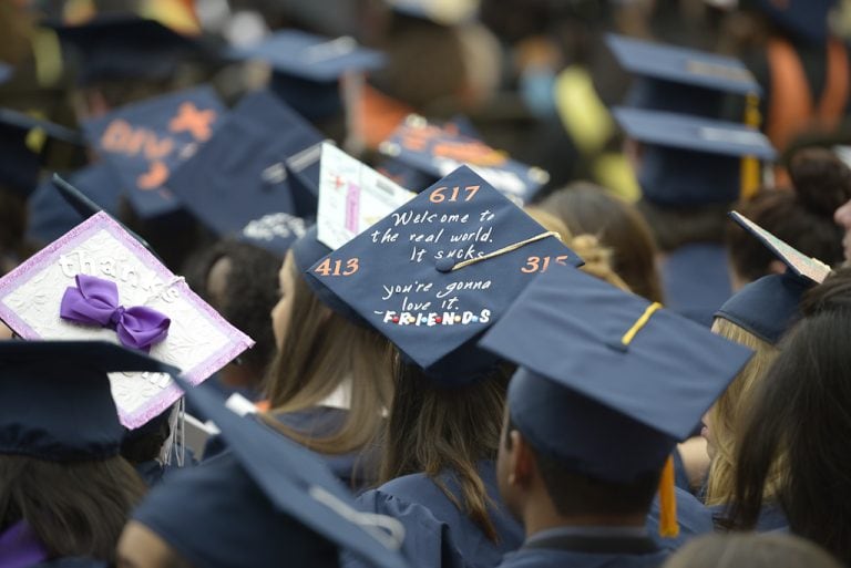 Graduation cap reads "Welcome to the real world. It sucks. You're gonna love it."