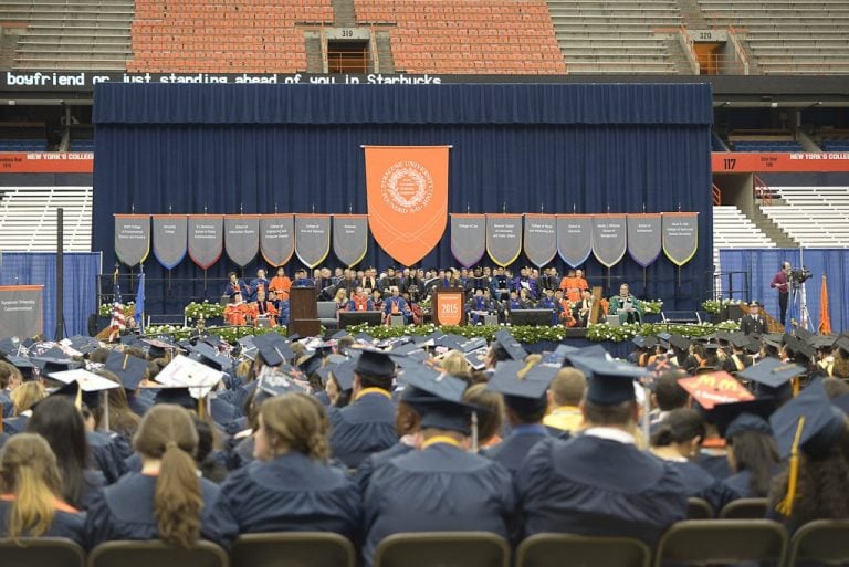 Students from Syracuse University and State University of New York College of Environmental Science and Forestry attend a commencement ceremony held on May 10, 2015 at the Carrier Dome.