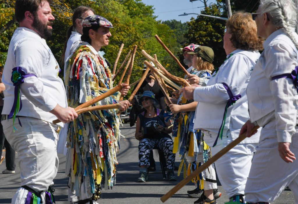 The Syracuse Morris Dancers perform on Sunday afternoon on Harvard Place, hoping to raise awareness of the traditional English form of folk dance. Photo shot on Sunday, October 1, 2023. (Photo by Finn Lincoln/TheNewshouse)