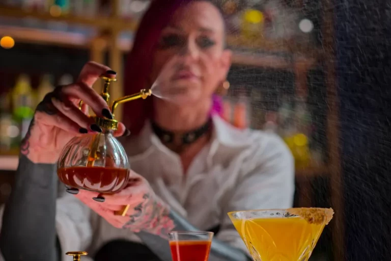 Spritzing a mixed drink in Netflix's "Drink Masters" streaming TV series.