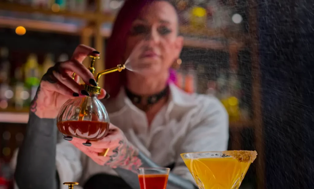 Spritzing a mixed drink on Netflix's Drink Masters