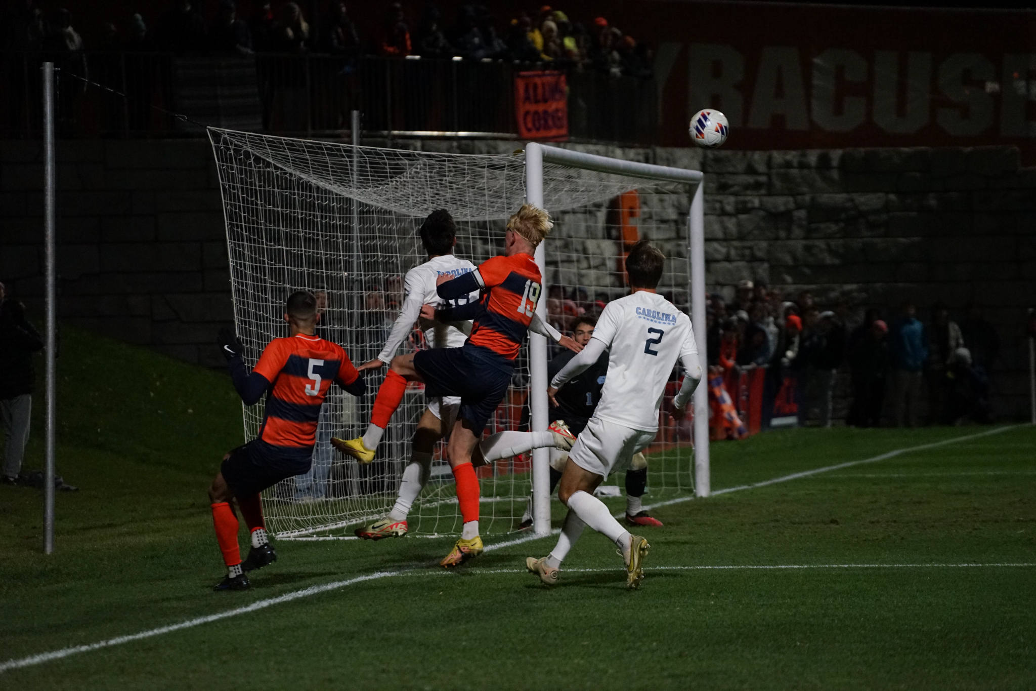 UNC narrowly avoids conceding a goal as it defends a corner.