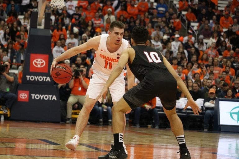 Syracuse University’s guard Joseph Girard (11), dribbles the basketball between his legs during a college basketball game against Seattle University on Nov. 16, 2019. Syracuse beat Seattle with a score of 89 to 67.