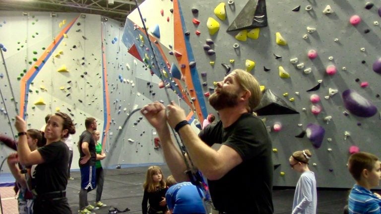 Greg Sommer instructing a rock climbing course at Syracuse's Central Rock Gym.