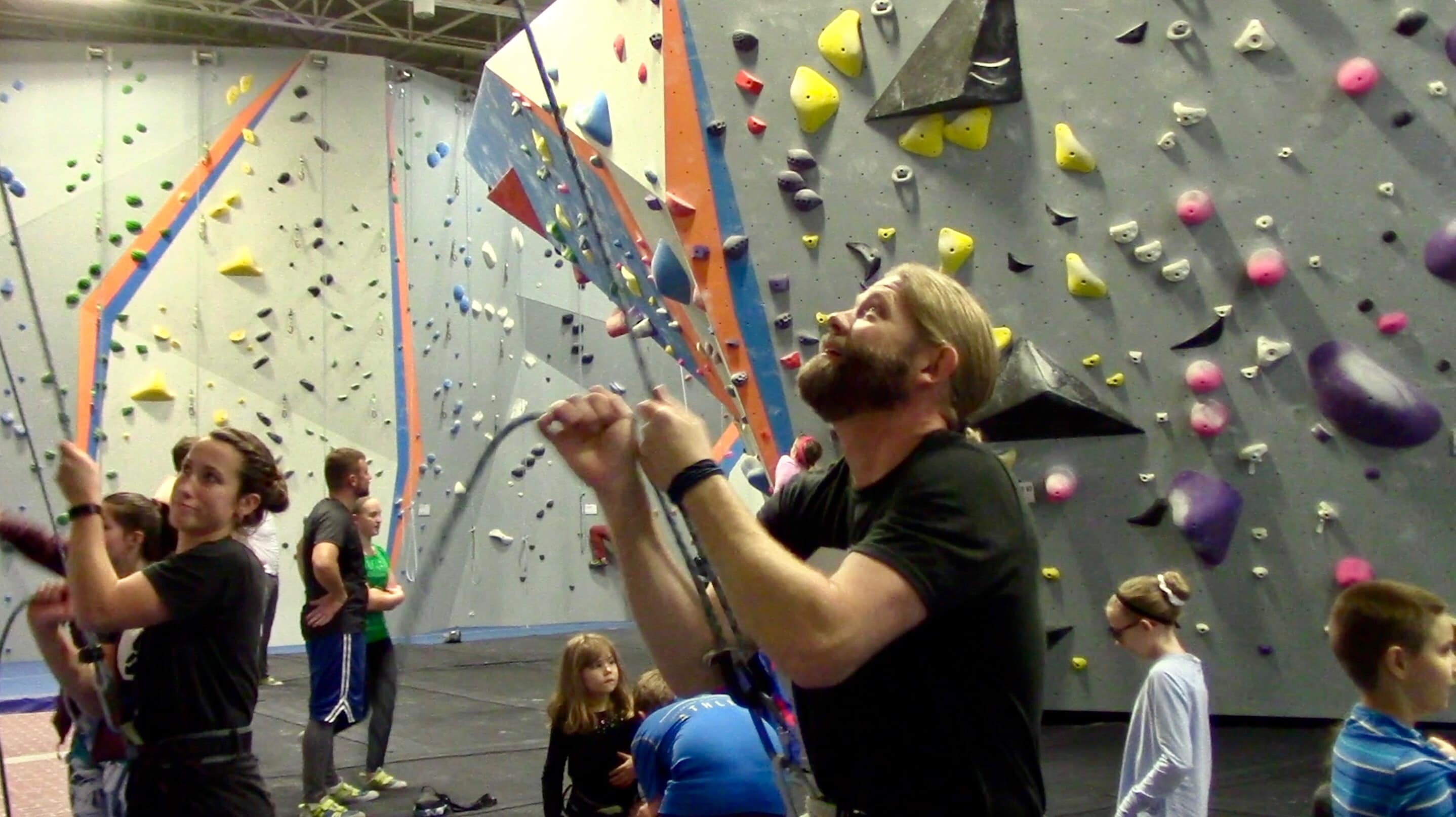 Greg Sommer instructing a rock climbing course at Syracuse's Central Rock Gym.