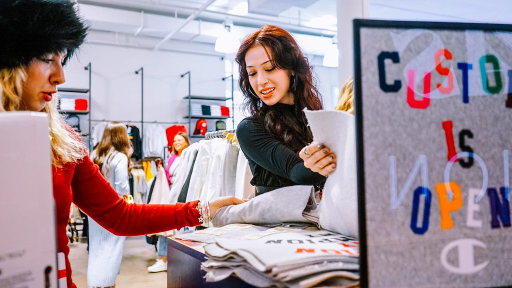 Young girl customizing clothing at a store