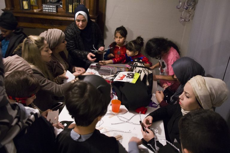 Mothers working on projects with their children