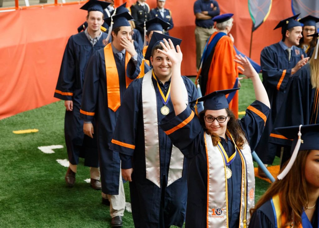 After waiting since 9 AM in the Carrier Dome for this moment, students proceed to the main seating area before the ceremony begins.