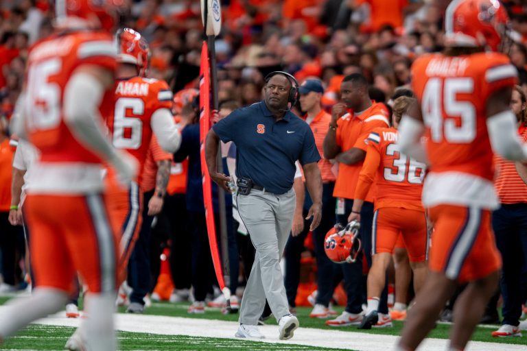 Syracuse football head coach Dino Babers walks the sidelines of the JMA Wireless Dome during the Clemson game on Sept. 30, 2023.