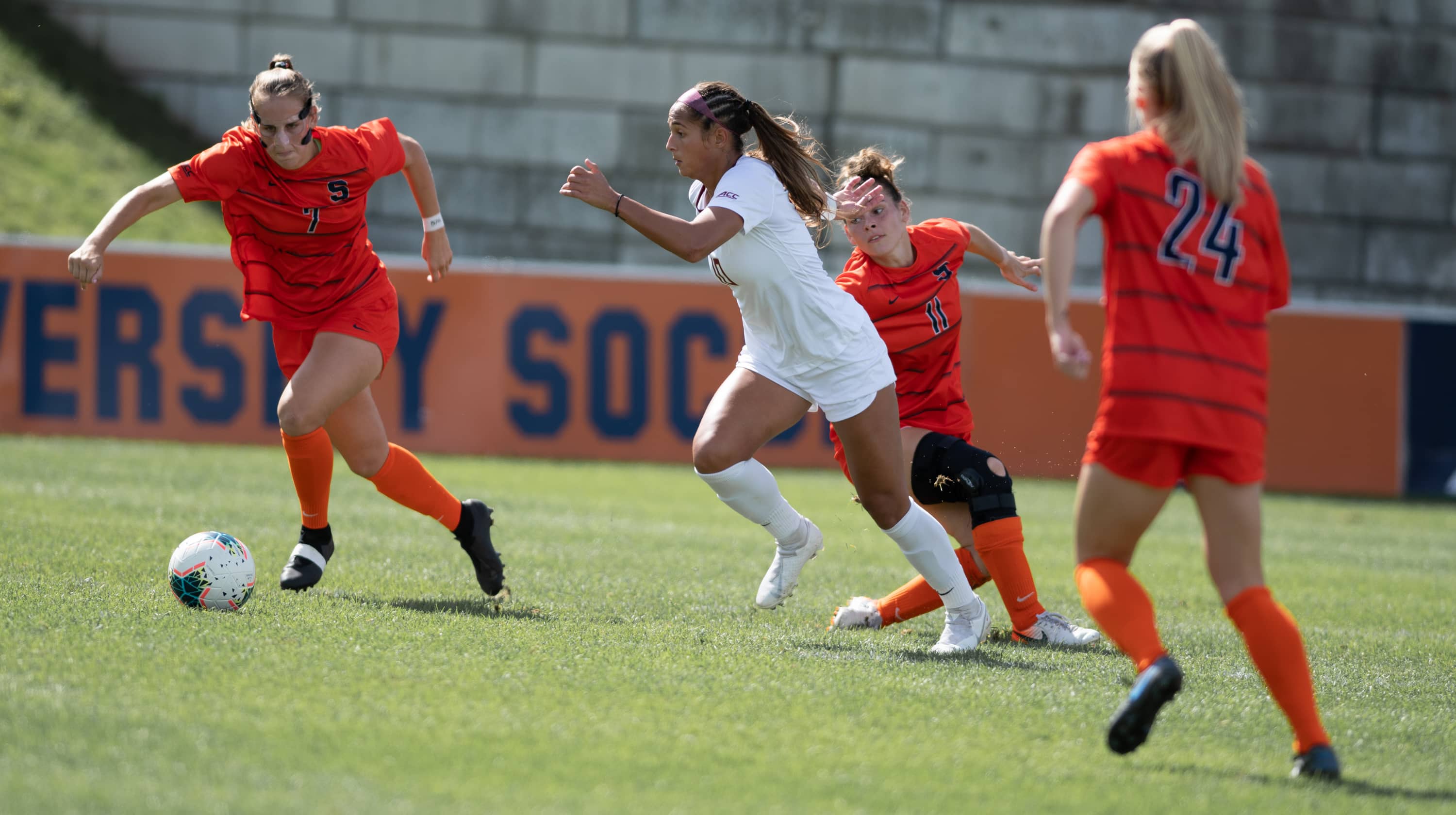 SU's Taylor Bennett (7), FSU's Deyna Castellanos (10) and SU's Jenna Tivnan (11) fight for the ball during the Sept 29 game.