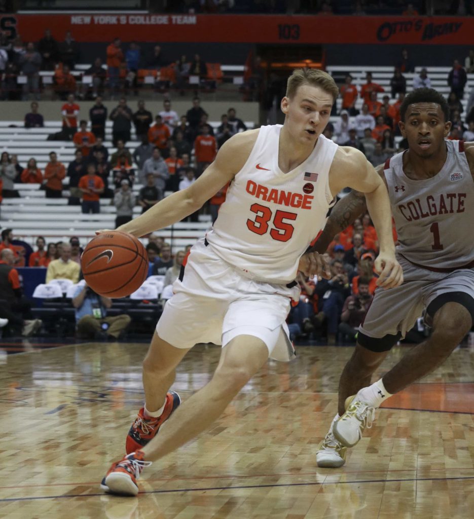 Syracuse University guard, Buddy Boeheim (35), dribbles the basketball down the court past Colgate defenders during a basketball game against Colgate University on Nov. 13, 2019. Syracuse beat Colgate with a score of 70 to 54.