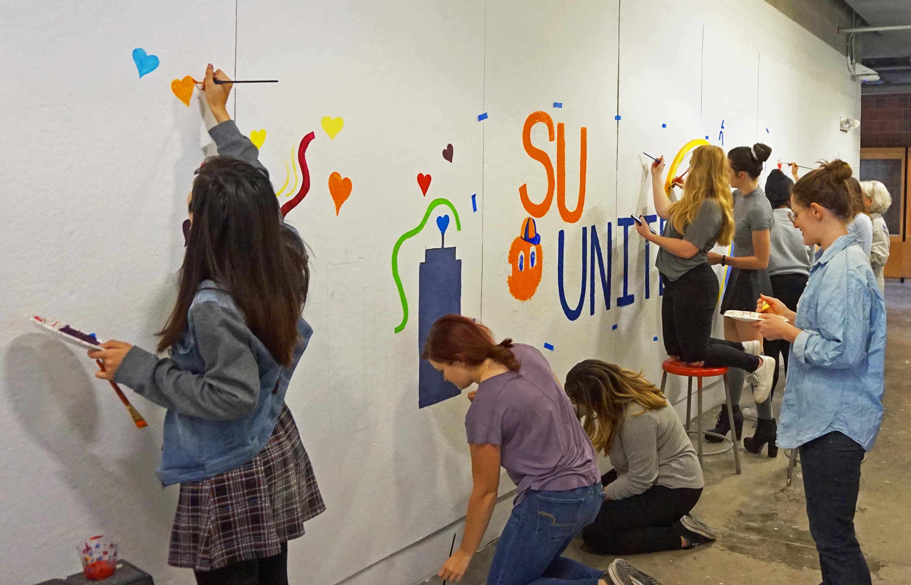 Students painting mural