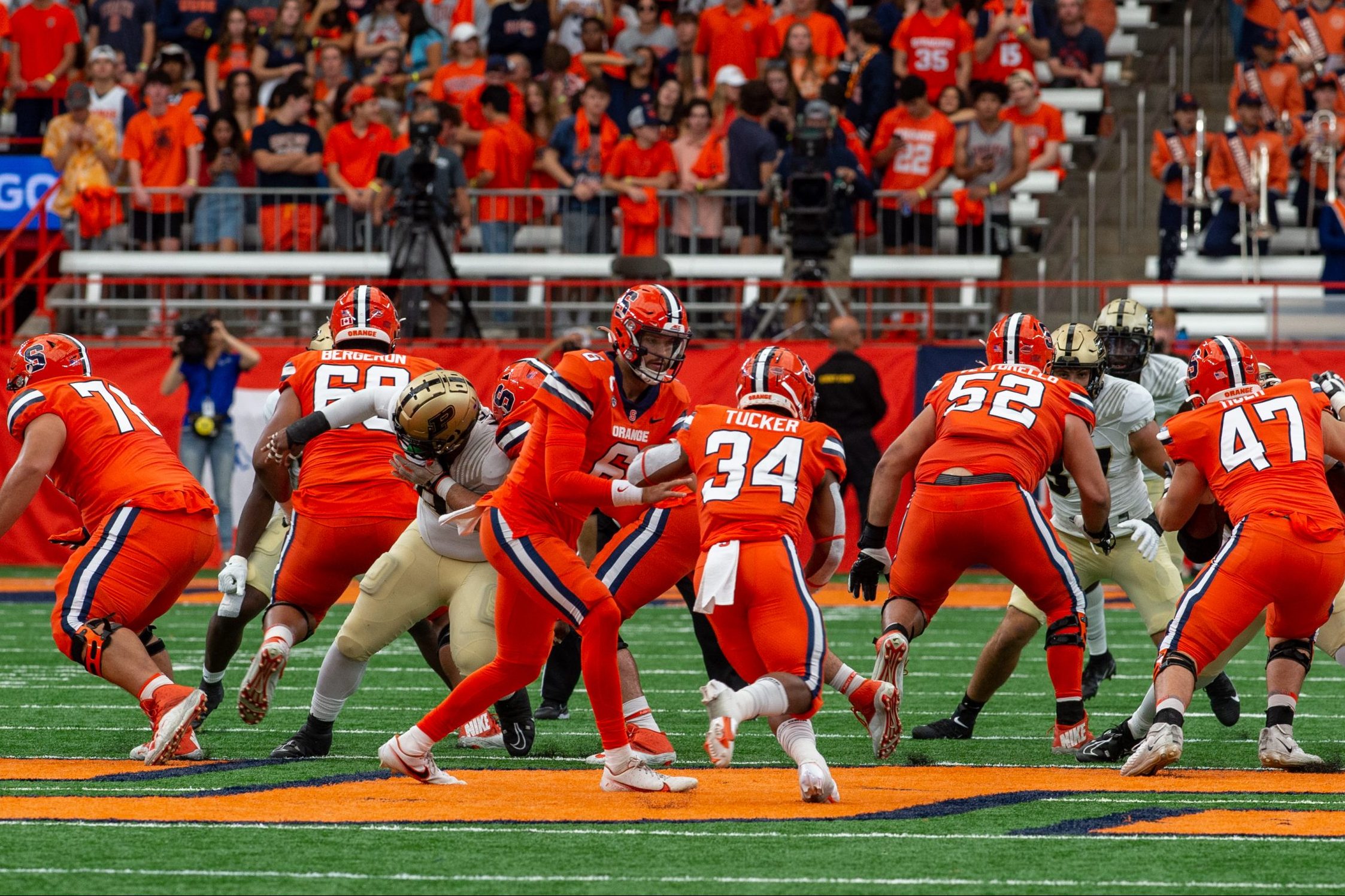 Syracuse quarterback Garrett Shrader hands the ball off to running back Sean Tucker during Saturday's game against Purdue.