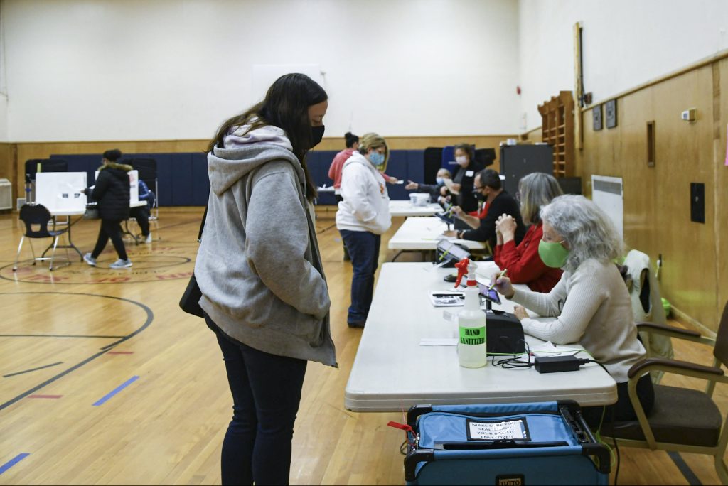 A voter checks in at the Salina Town Hall polling station before casting their ballot.
