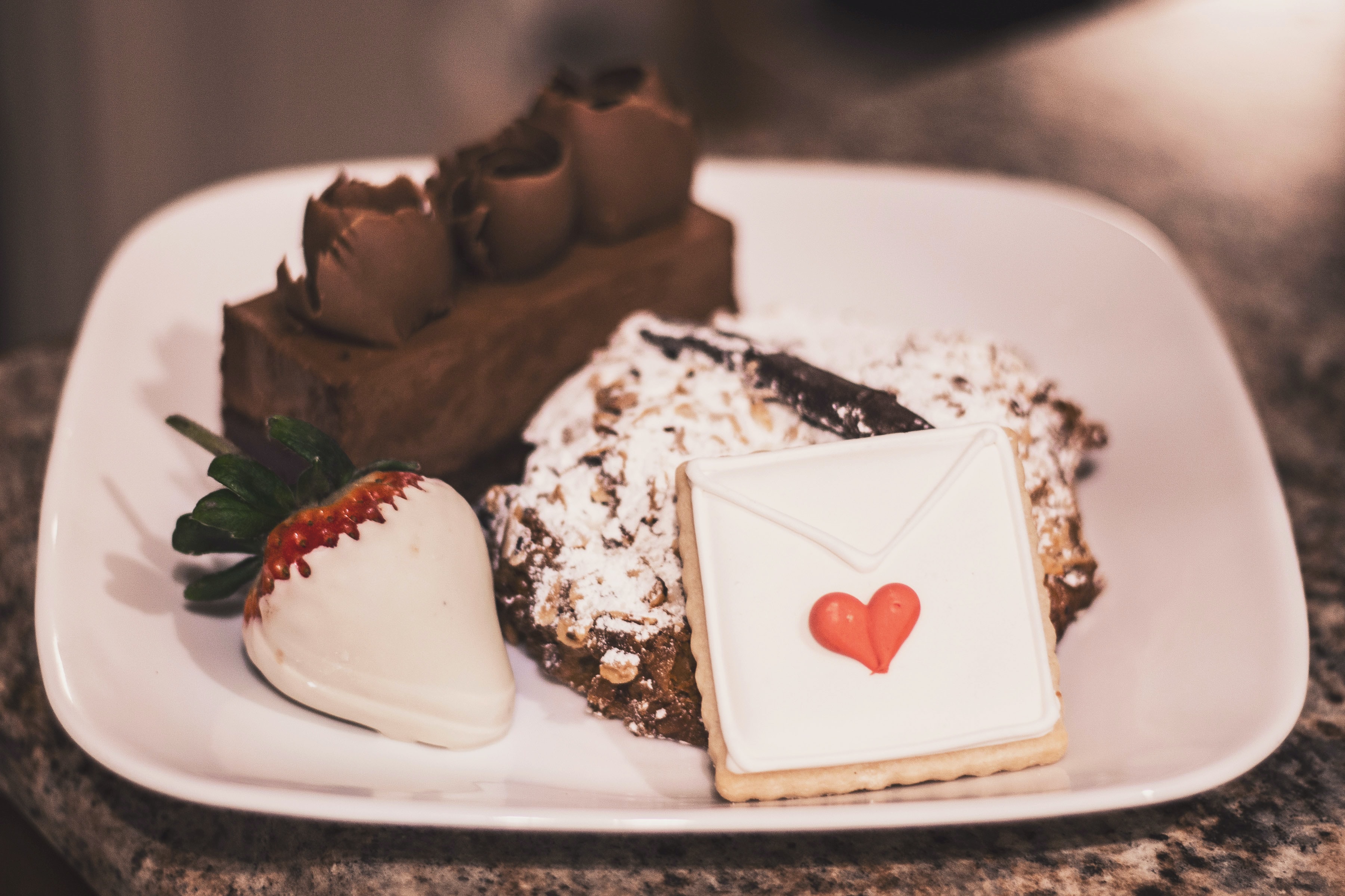 An assortment of chocolates sits on a plate.