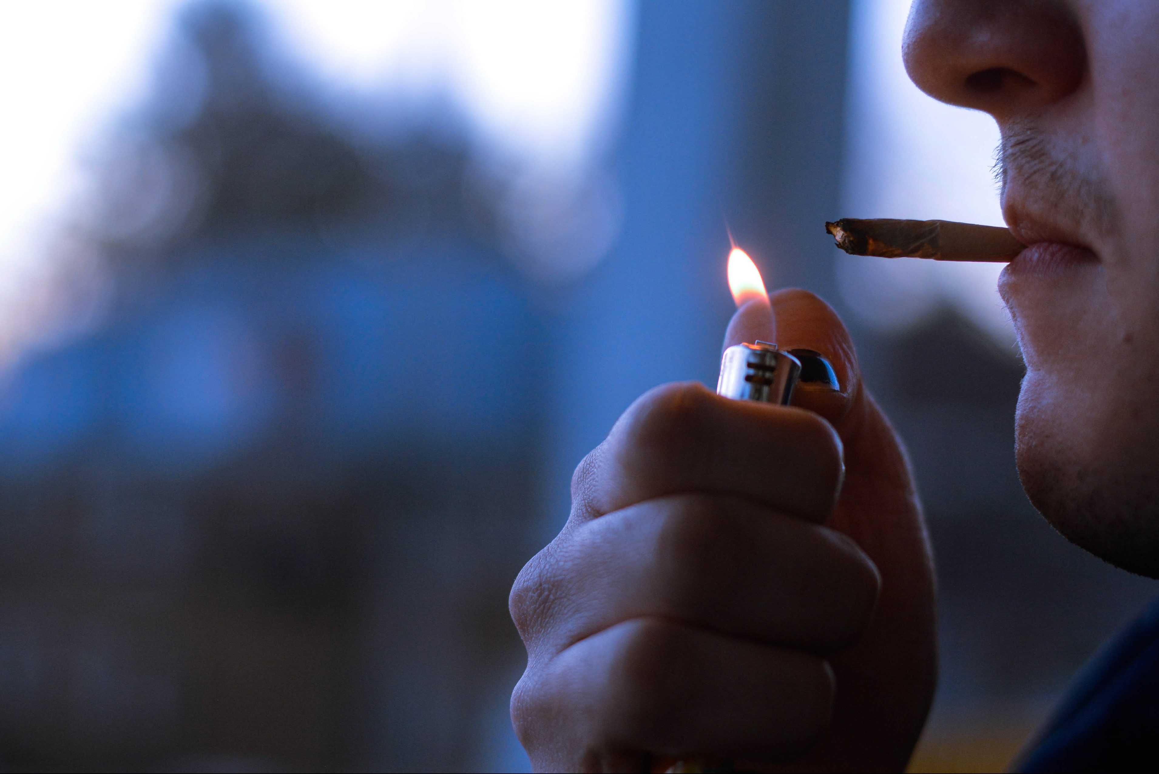 A Syracuse student smokes marijuana at their apartment.