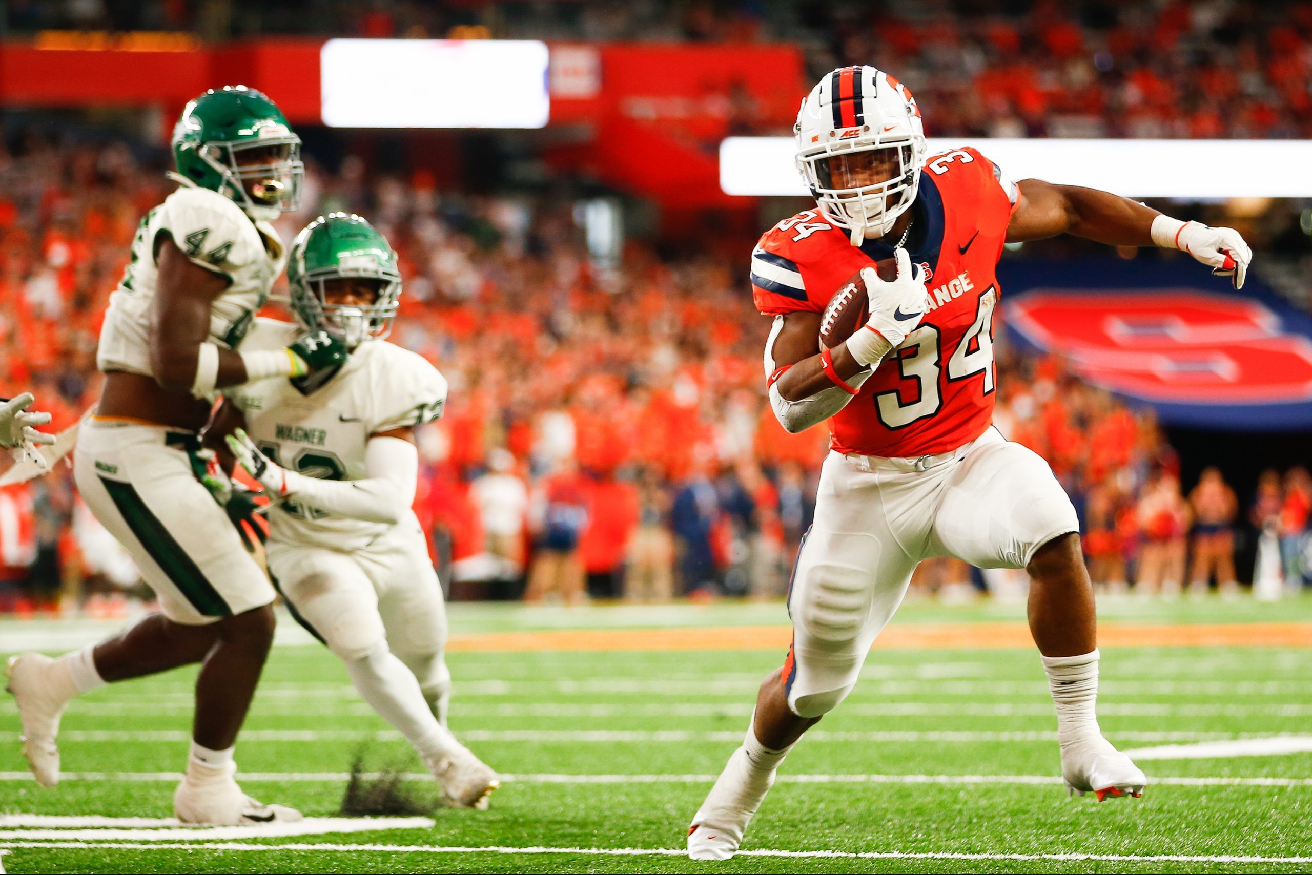 SYRACUSE, NY - OCTOBER 1: Sean Tucker #34 of Syracuse Orange runs towards the edge against the Wagner Seahawks at JMA Wireless Dome on October 1, 2022 in Syracuse, New York. (Photo by Isaiah Vazquez)