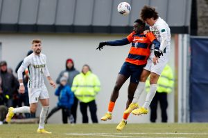 SYRACUSE, NY - DECEMBER 3: Nathan Opoku #10 of the Syracuse Orange and Zach Barrett #28 of the Vermont Catamounts compete for the ball during the quarterfinals of the NCAA Men’s Soccer Championship at SU Soccer Stadium on December 3, 2022 in Syracuse, New York. (Photo by Isaiah Vazquez/The Newhouse)