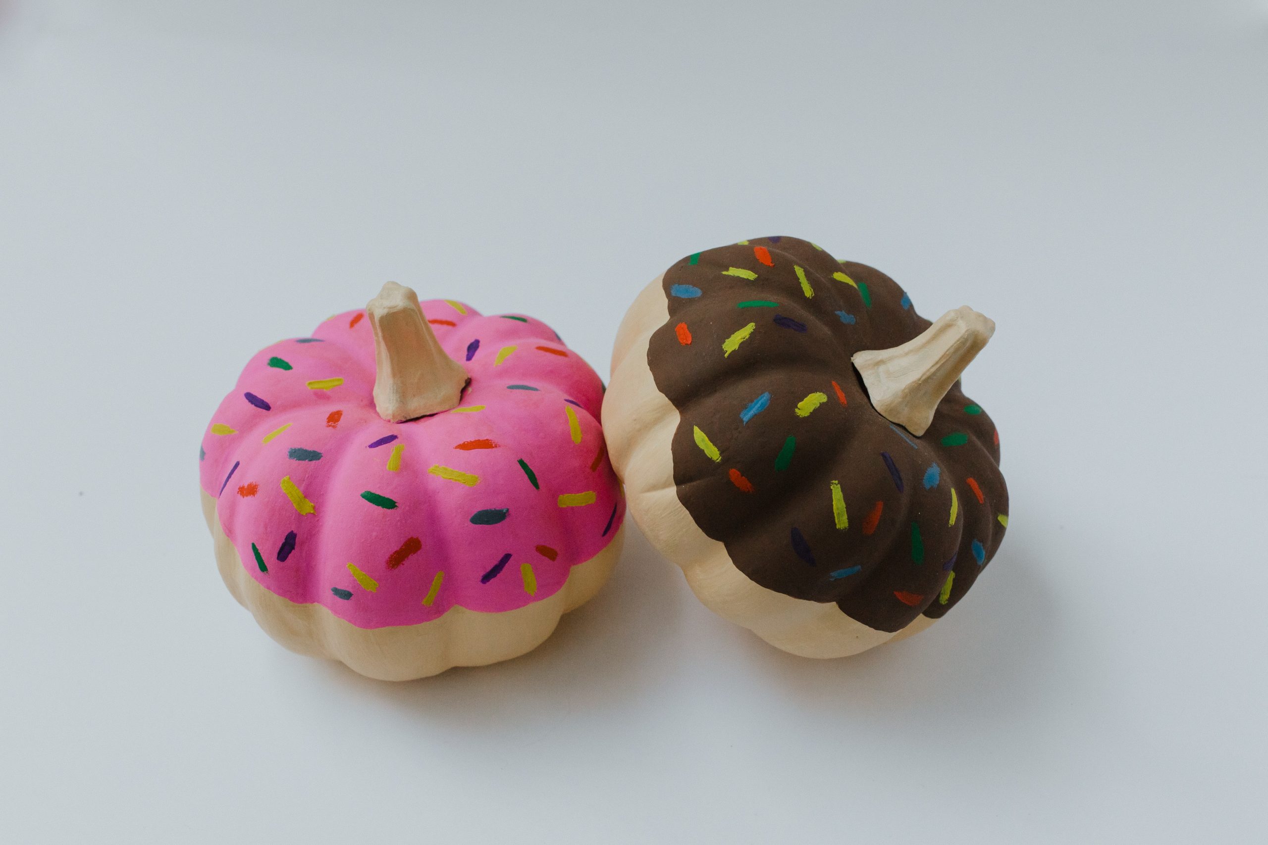 Pumpkins painted to resemble donuts.