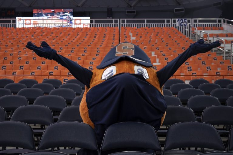 SU's iconic mascot, Otto the Orange, poses in the bleachers of the Carrier Dome. Photo by Christopher Cicchiello