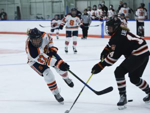 Syracuse's Victoria Kilmek takes a shot open goal around RIT's Ellie Larson.