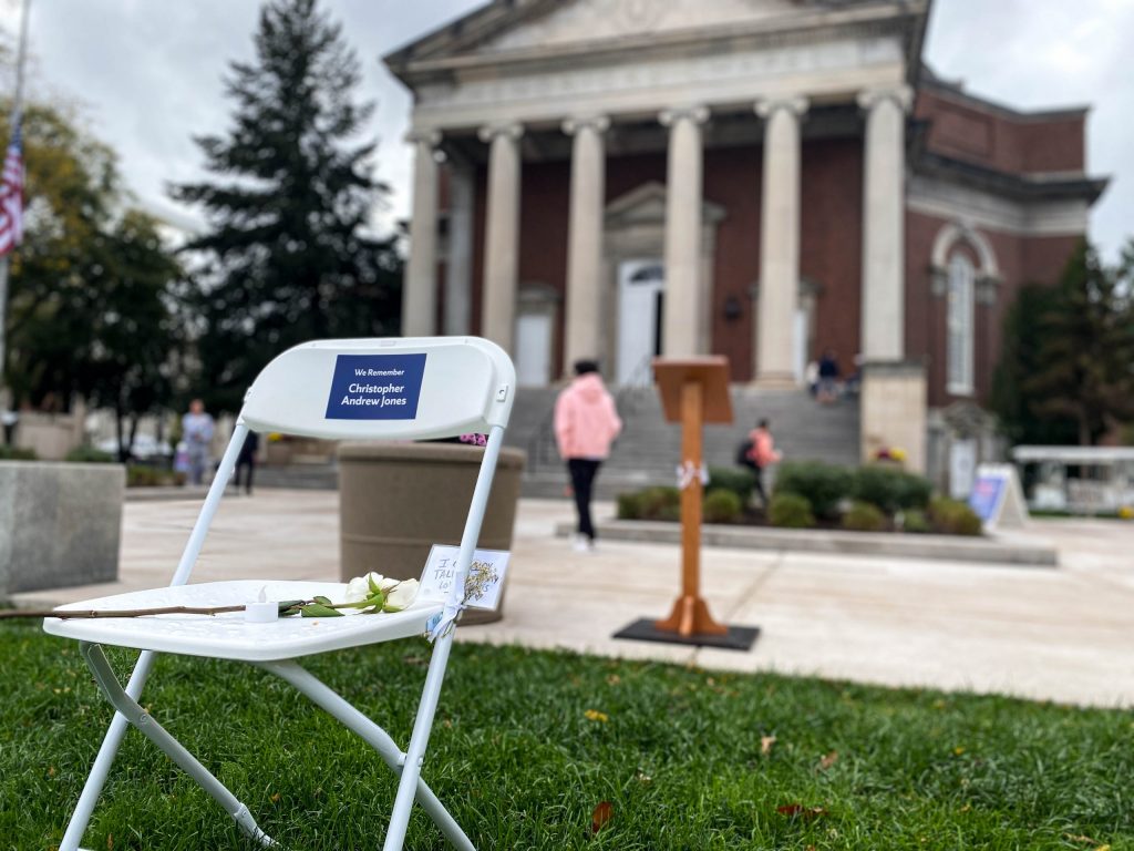 A note sits atop the chair dedicated to Christopher Andrew Jones while people enter Hendricks Chapel prior to the Remembrance Scholar Convocation.