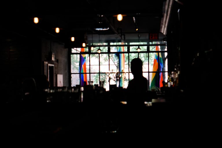 Bar interior with Gay Pride flags on display