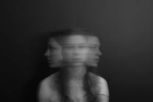 Double Exposure of Woman Moving Head