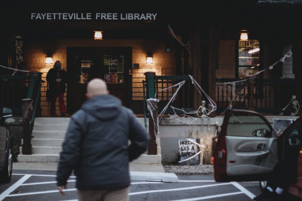 Locals enter the Fayetteville Free Library to vote on election night 2020.