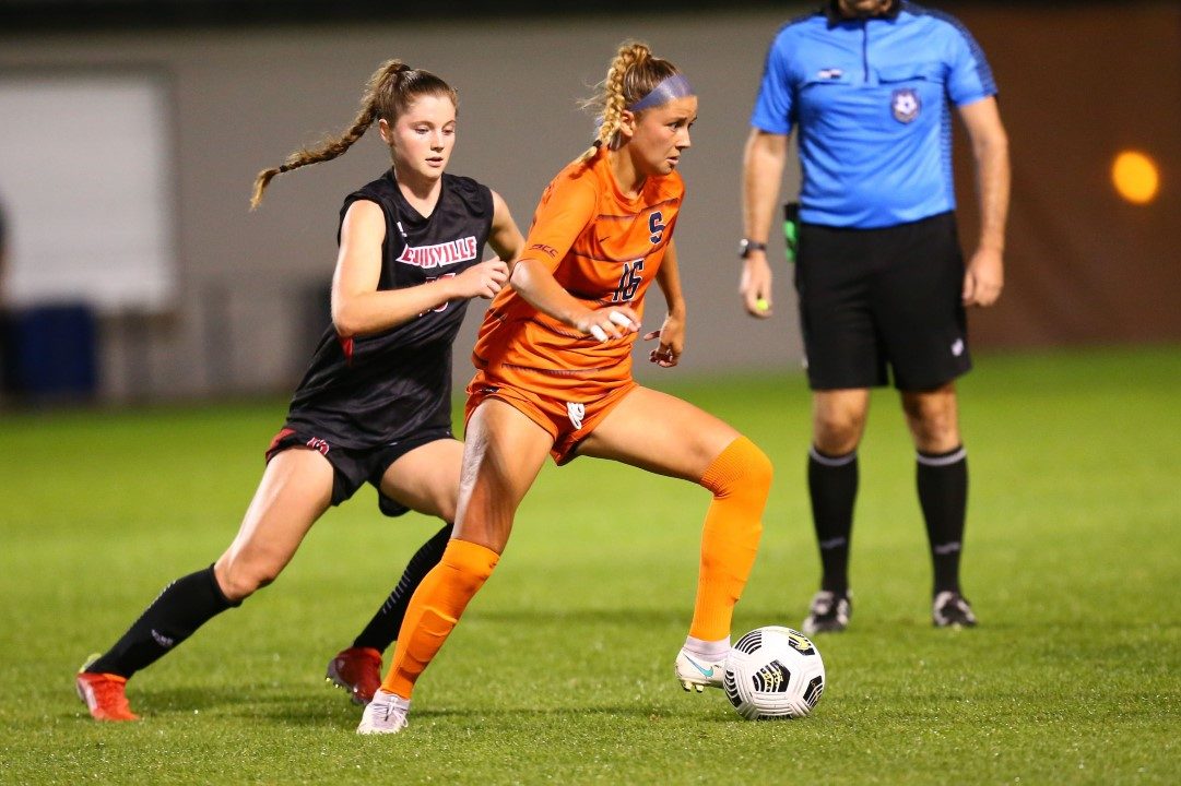 Syracuse midfielder Koby Commandant (16) escapes a Louisville Cardinals defender at SU Soccer Stadium on Thursday, Sept. 23, 2021.